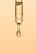 © Mariana Ibanez/Stocksy - Serum on dropper