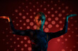 © Clique Images/Stocksy - Queer Man Posing In Dark Studio