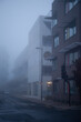 © Julia Forsman/Stocksy - Buildings on a foggy street in East London