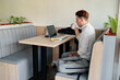 © J Esteban Berrío/Stocksy - Freelancer enjoying coffee in cafe