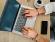 © J Esteban Berrío/Stocksy - College student typing on a laptop