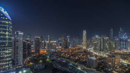  Panorama showing Dubai Downtown and business bay night timelapse with tallest skyscraper and other towers