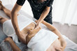 © Santi Nuñez/Stocksy - Therapist massaging a patient's stomach