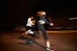 © Javier Díez/Stocksy - Energetic diverse people running together on street