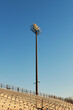© Iryna Shepetko/Stocksy - An Empty Stadium Stand against a blue sky, sunrise