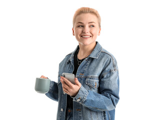 Poster - Young woman with mobile phone and cup of tea on white background