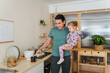 © Nuria Seguí/Stocksy - A Man And His Daughter In The Kitchen