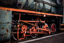 Red Metal Wheels Of A Vintage Steam Locomotive.