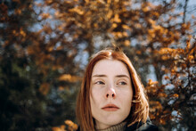 Portrait Of A Red-haired Girl In Autumn Park