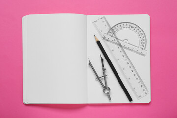 Wall Mural - Rulers, compass, pencil and notebook on pink background, flat lay