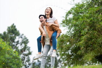 Wall Mural - Photo of young Asian couple outside