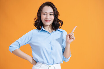 Wall Mural - Photo of young Asian woman on background