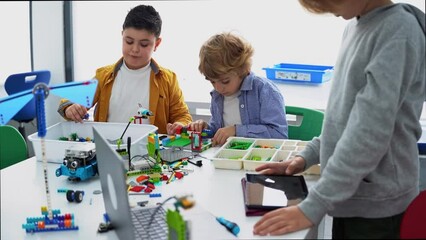 Wall Mural - robotics programming class. children construct and code robot. stem education using constructor bloc