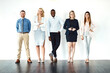 © Arnell Koegelenberg/peopleimages.com - Portrait, smile and teamwork of business people by white wall background mockup in office workplace. Face, confident group and lawyers standing together with arms crossed, diversity and collaboration