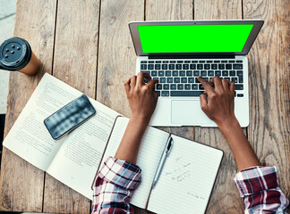 Canvas Print - Woman, hands and laptop of student on green screen mockup above for studying, education or research at cafe. Top view of female person hand on computer display for university project at coffee shop