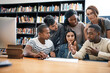 © Jadon Bester/peopleimages.com - Students in library, studying together and discussion, exam or research for project, education and teamwork. Diversity, young men and women in study group and learning with collaboration on campus