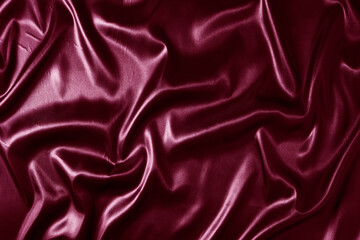 Silk fabric, abstract wavy vinous satin fabric background.