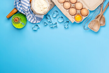 Poster - Cooking ingredients and utensils on blue background