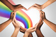 © Puttachat - Inspirational idea unity and creative team for creativity thinking together as a diverse group of people together joining hands into the shape of a heart as an ideas concept.