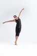 © danmorgan12 - Ballet Dancer Young Athletic Man in Black Suit Posing in Stretching Dance Pose Studio