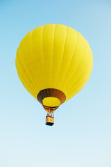 Wall Mural - view of air balloon with basket flies on sunset