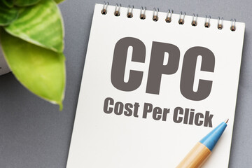 Wall Mural - CPC - Cost Per Click words in an office notebook.