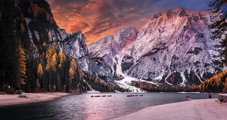 Aufkleber - Incredible view on majestic famouse lake Braies in autumn season. Wonderful sunny landscape in dolomites Alps with colorful sky. Amazing nature Scenery. Lake Braies is also known as Lago di Braies