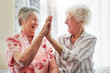 © Camerene Pendl/peopleimages.com - Happy, love and senior women with a high five for care, retirement support and happiness. Smile, team and elderly friends with excited gesture for solidarity or lifestyle in a nursing home together
