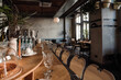 © Drobot Dean - Contemporary interior in cafe with bar and chairs with concrete walls and wooden floor indoors