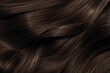 © Vera - Brown hair close-up as a background. Women's long brown hair. Beautifully styled wavy shiny curls. Hair coloring. Hairdressing procedures, extension.