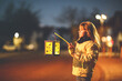 © Irina Schmidt - Little preschool kid girl holding selfmade traditional lanterns with candle for St. Martin procession. child happy about children and family parade in kindergarten. German tradition Martinsumzug