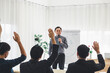 © topkritsada - The supervisor is presenting business plans to employees in the company