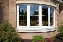 Bow Vinyl Window In A Brick House, Exterior View