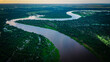 aerial view of pantanal wetland Brazil with jungle forest stream river at sunset 