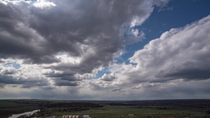 Wall Mural - dark beautiful clouds, dramatic sky over a beautiful valley. the clouds are moving forward. 4k timel