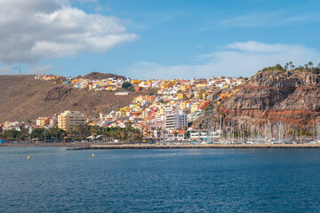 Wall Mural - View of the city and the port of San Sebastian de la Gomera seen from the ferry heading to Tenerife. Canary Islands
