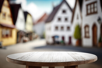 empty table top with blurry backdrop of bavarian village, ai generated