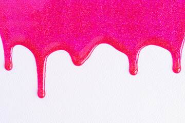 pink glitter sparkle confetti background liquid drops of paint color flow down on white canvas. dark