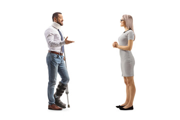 Canvas Print - Injured man with an orthopedic boot and cervical collar talking to a woman