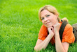 © Designpics - Young woman relaxing on the grass