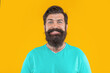 © be free - portrait of excited bearded man. portrait of bearded man isolated on yellow.