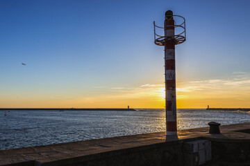 Poster - Sunset over Douro river mouth to Atlantic Ocean in Foz do Douro area of Porto city, Portugal