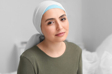 Wall Mural - Young woman after chemotherapy in bedroom, closeup