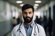 Portrait of a serious male doctor standing in the corridor of the hospital