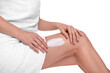 © New Africa - Woman with smear of body cream on her leg against white background, closeup