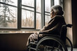 © Kenishirotie - Lonely senior citizen woman in wheelchair in a nursing home. Generative AI.