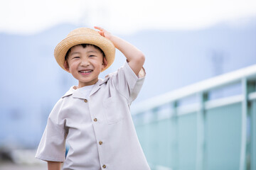 Wall Mural - 麦わら帽子をかぶった笑顔の男の子　Smile