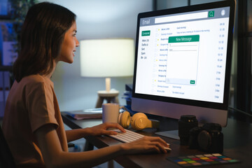 woman using computer on table and write an email on website, communication connection message to glo