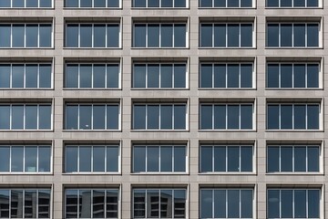 Wall Mural - modern skyscraper with a glass facade and many floors generative ai