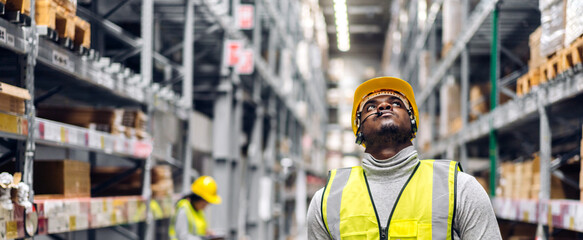 Portrait two african american engineer team shipping order detail export and import,industry 4.0,goods,factory,warehouse,international trade,transportation,cargo ship,logistic,distribution. industry